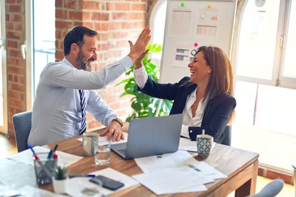 Business owner shaking hands with a satisfied client